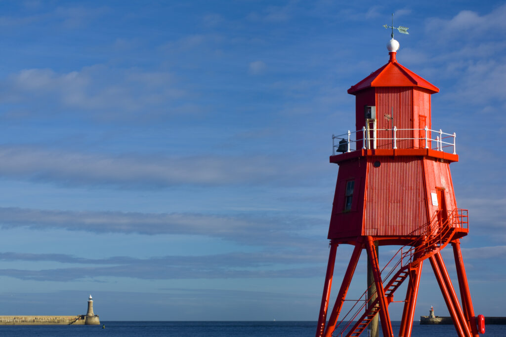 England, Tyne & Wear, South Shields. The South Groyne Lighthouse in South Shields, with the North Pier Lighthouse in the distance.