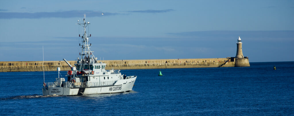 England, Tyne & Wear, South Shields. The HMCC Vigilant, a HM Customs offshore Patrol Vessel, heading towards the North Sea as it exits the mouth of the Tyne.