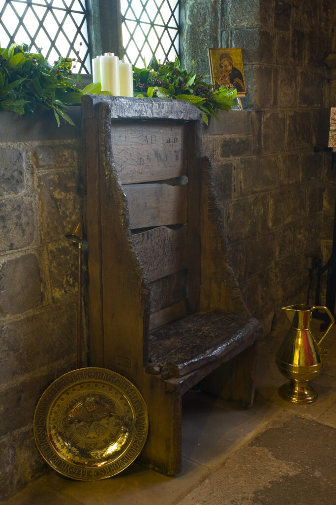 England, Tyne and Wear, St Pauls Monastery and church. Bedes chair, an ancient oak seat between 800 to 1100 years presumed to have belonged to the venerable Bede.