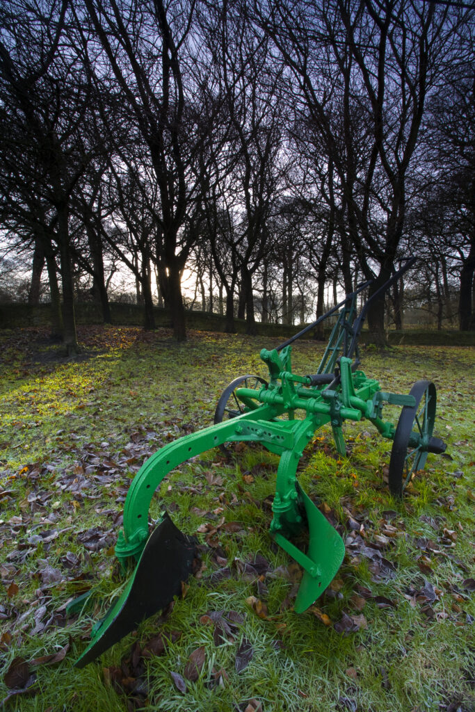 England, Tyne & Wear, Backworth. Hand plough in Backworth Village, depicting the farming heritage of the Tyneside region.