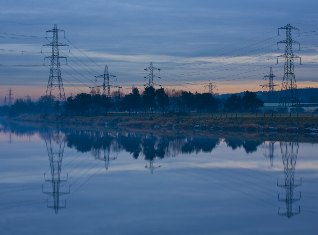England, Tyne & Wear, Newburn. Electricity pylons distribute electricity across the River Tyne from Ryton to Newburn.