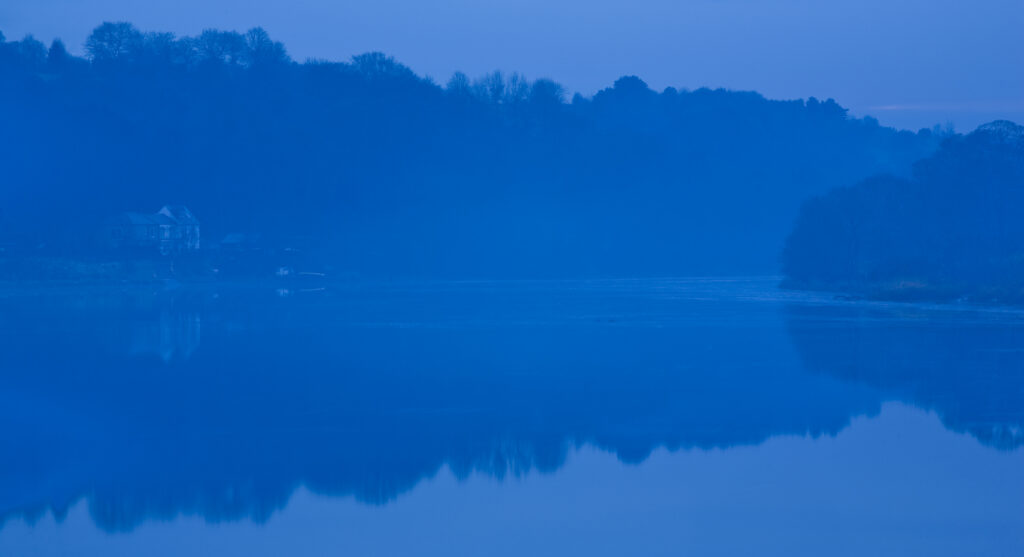 England, Tyne & Wear, Newburn. Mist lingers on the River Tyne near Newburn.
