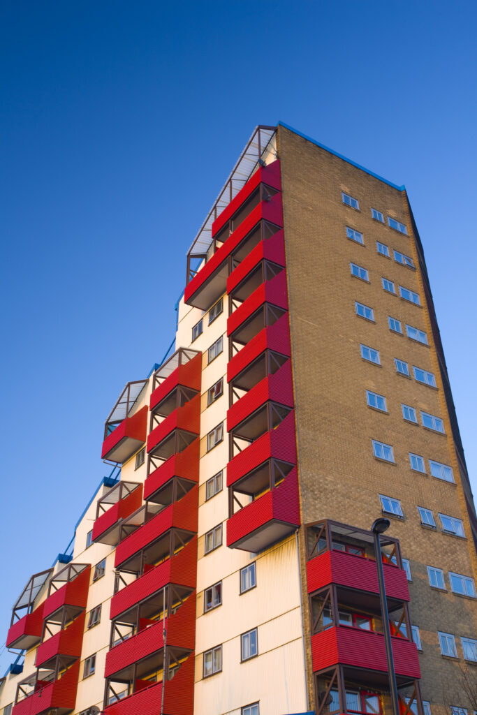 England, Tyne and Wear, Byker. Tom Collins House forms part of the Byker Wall, an award winning design comprising of a continuous block of maisonettes conceived by Ralph Erskrine. In 2007 the wall became a Grade II listed building of outstanding architecture.