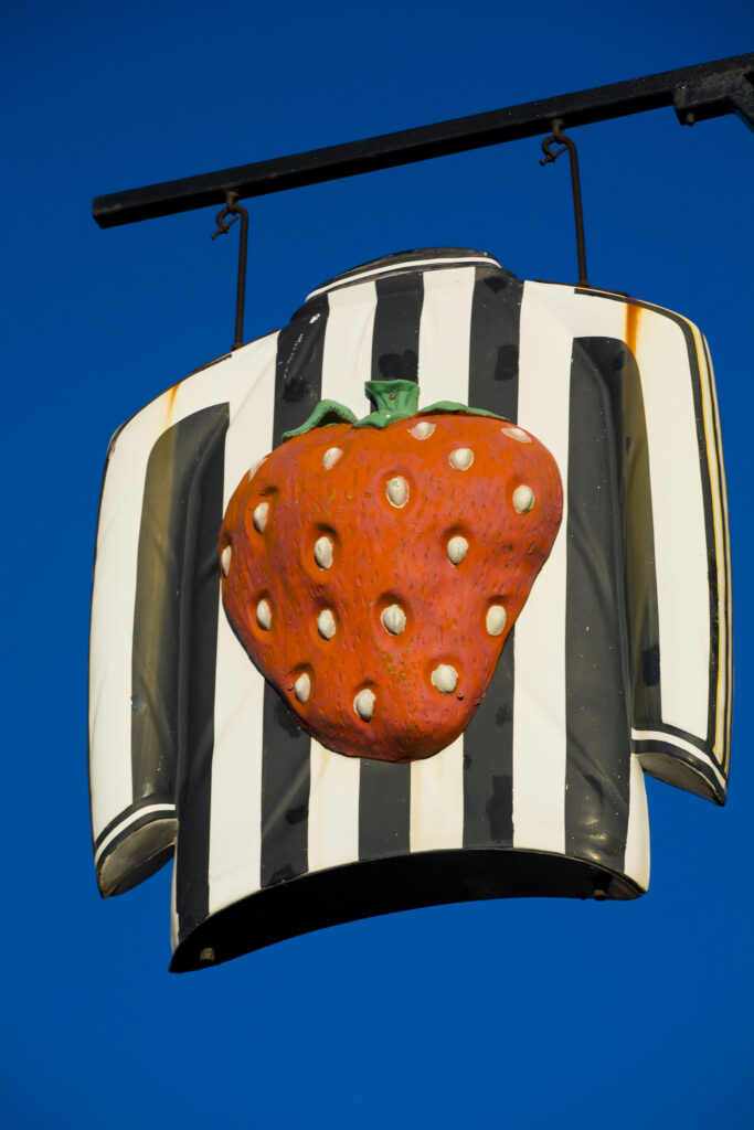 England, Tyne and Wear, Newcastle Upon Tyne. Newcastle United football strip immortalised as a sign for the Strawberry public house near St James Park.