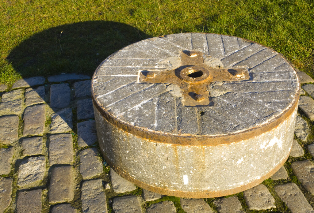 England, Tyne and Wear, Newcastle Upon Tyne. Granite mill-stone from the Gallowgate Lead Works which were located within Newcastle City for over 150 years, finally closing in 1933.