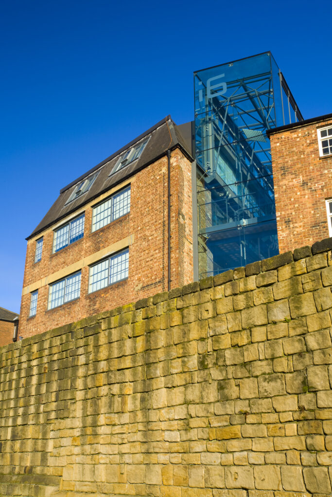 England, Tyne and Wear, Newcastle Upon Tyne. The city wall of Newcastle Upon Tyne. The city continues to develope into an ecletric mix of historic and modern architecture.
