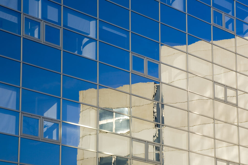 England, Tyne and Wear, Newcastle Upon Tyne. Present day building structures reflected in the windows of an office block in Newcastle Upon Tyne.