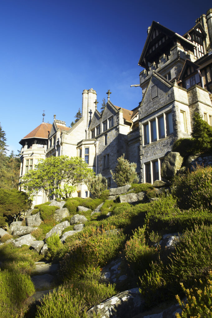 England, Northumberland, Cragside Gardens & Estate. Cragside house located within the gardens of the Cragside estate (National Trust)