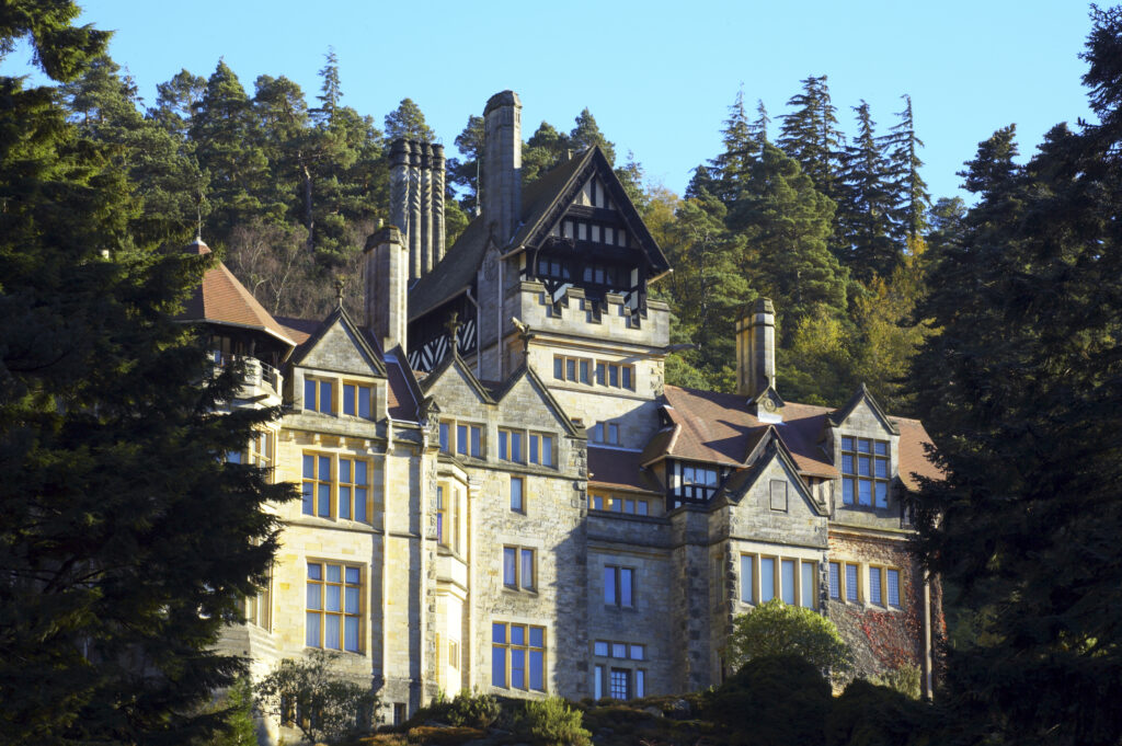 England, Northumberland, Cragside Gardens & Estate. Cragside house located within the gardens of the Cragside estate (National Trust)
