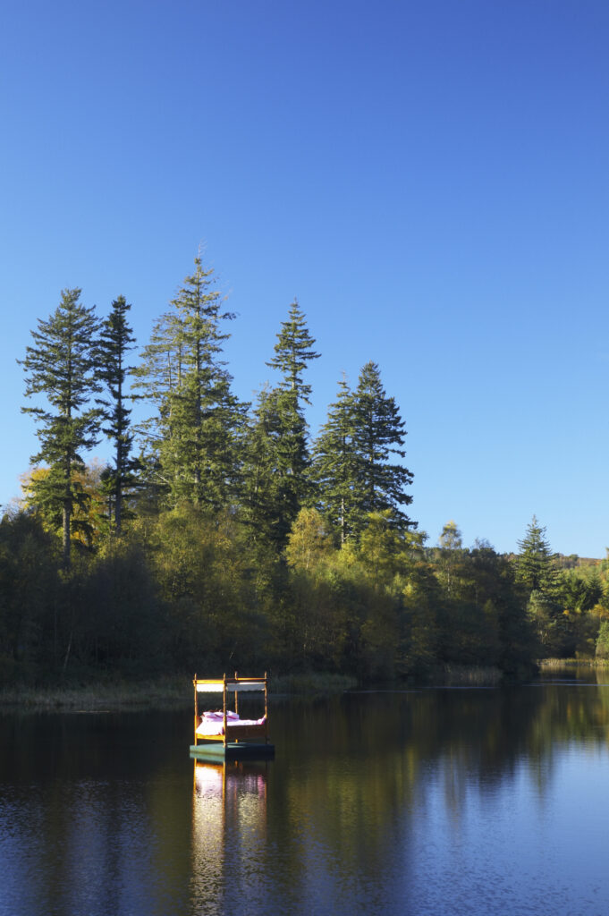 England, Northumberland, Cragside Gardens & Estate. A floating bed on Tumbleton Lake, part of the Inside Out exhibition at Cragside (National Trust)