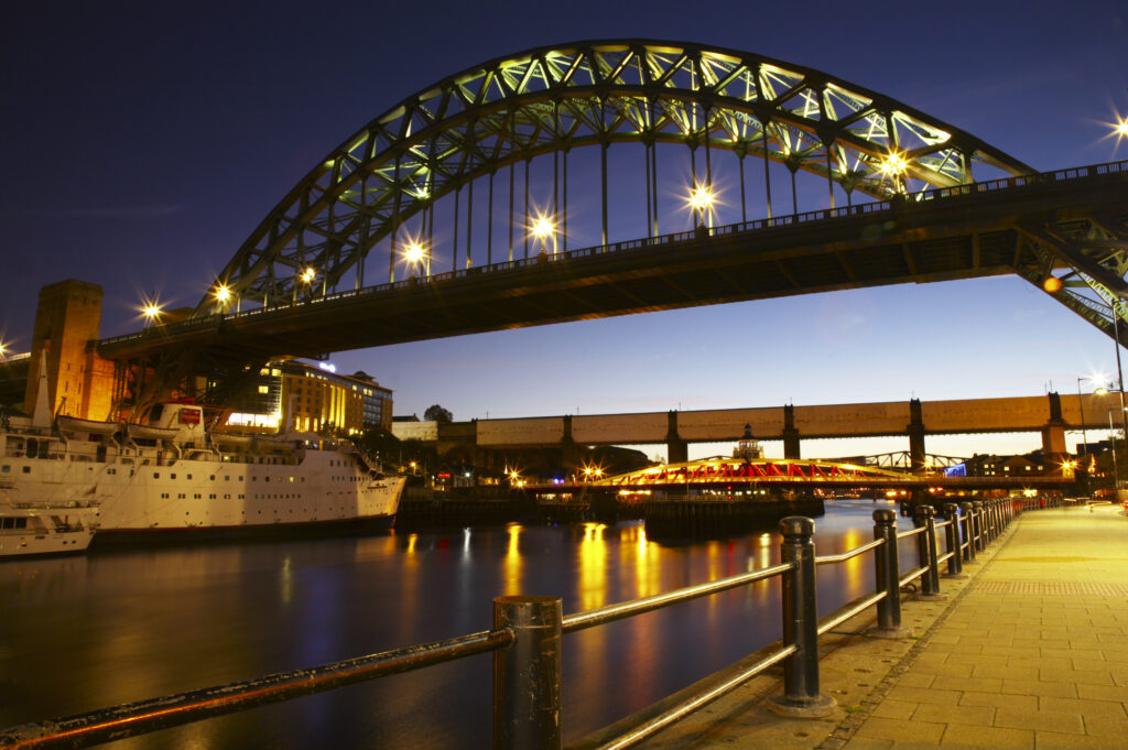 The world famous Tyne Bridge and River Tyne in the city of Newcastle Upon Tyne.
