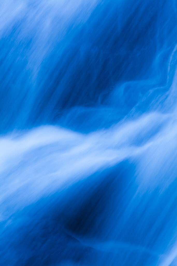 England, Northumberland, Hareshaw Linn. Detail shot of a cascade of water, part of the Hareshaw Linn waterfall.