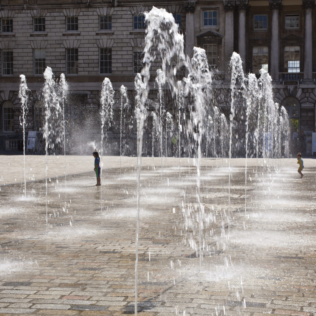England, City of London, Somerset House. Dancing fountains in the central courtyard of Somerset House in London.