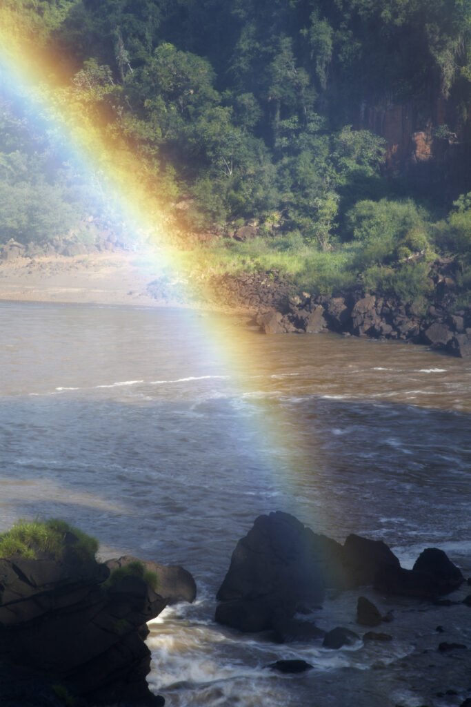 Argentina, Misiones, Iguazu National Park. Rainbow near the impressive Iguazu waterfalls - A world heritage site.