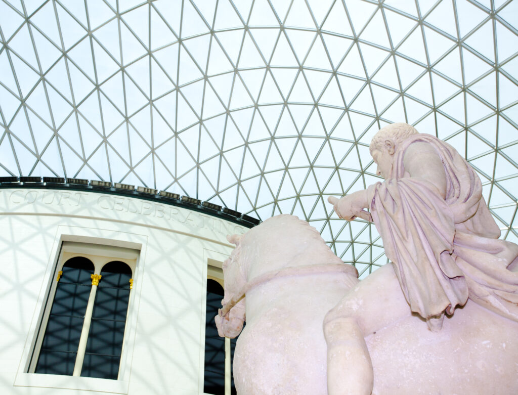 England, Greater London, London Borough of Camden. Statue portraying a young man mounted on a horse, located in the covered great courtyard of the British Museum, Bloomsbury, London.