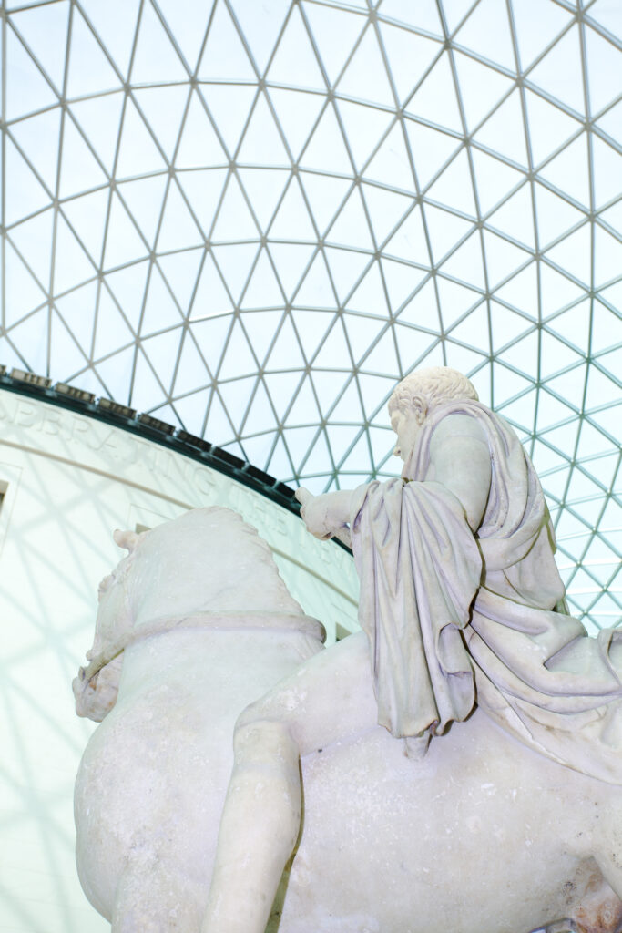 England, Greater London, London Borough of Camden. Statue portraying a young man mounted on a horse, located in the covered great courtyard of the British Museum, Bloomsbury, London.