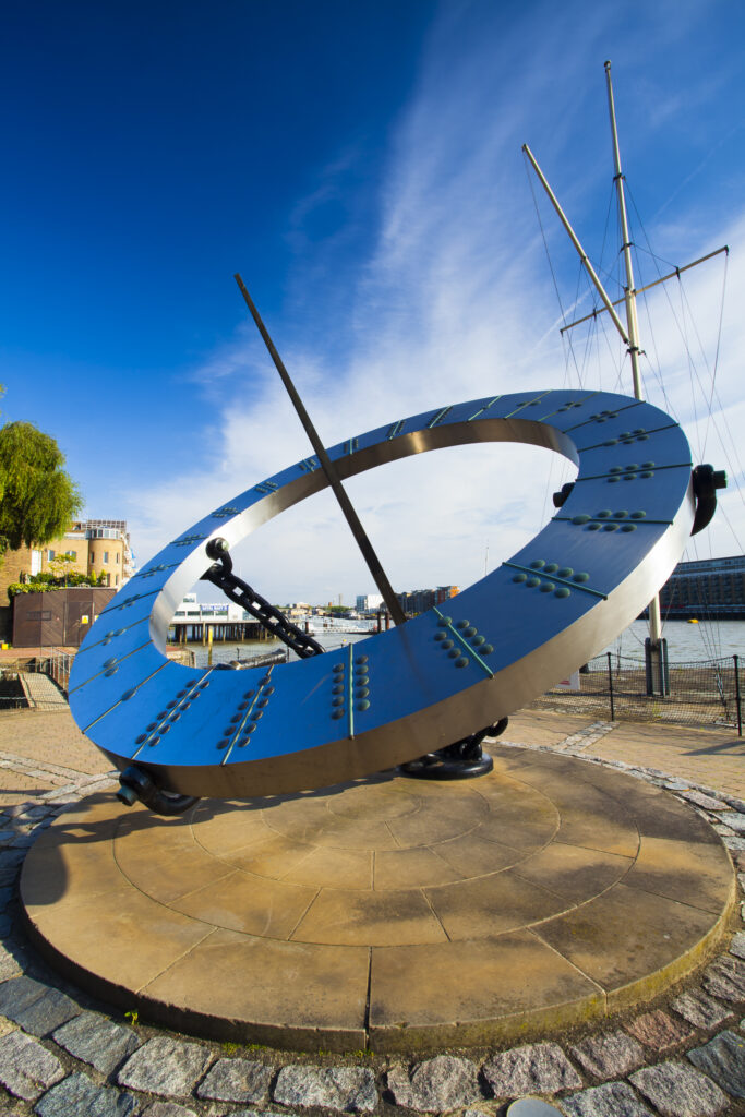 England, Greater London, London Borough of Tower Hamlets. Sun dial near the entrance to the St Katharine Docks, on the north bank of the River Thames near the London Tower Bridge.
