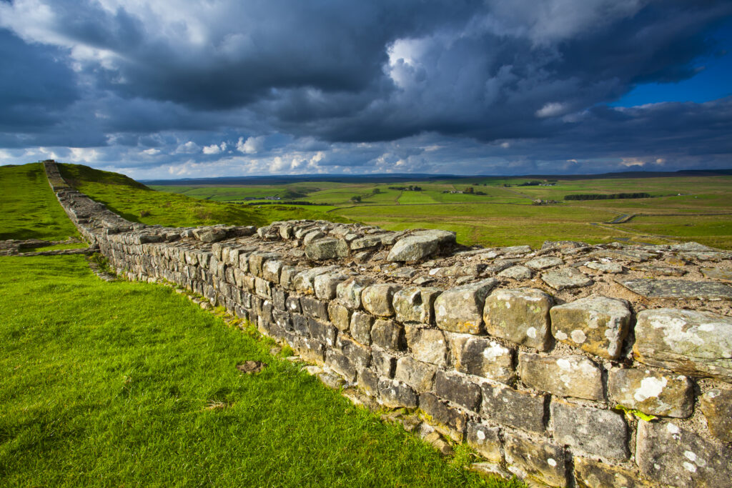 England, Northumberland, Northumberland National Park. A well preserved stretch of Hadrian's Wall passing along Caw Gap.
