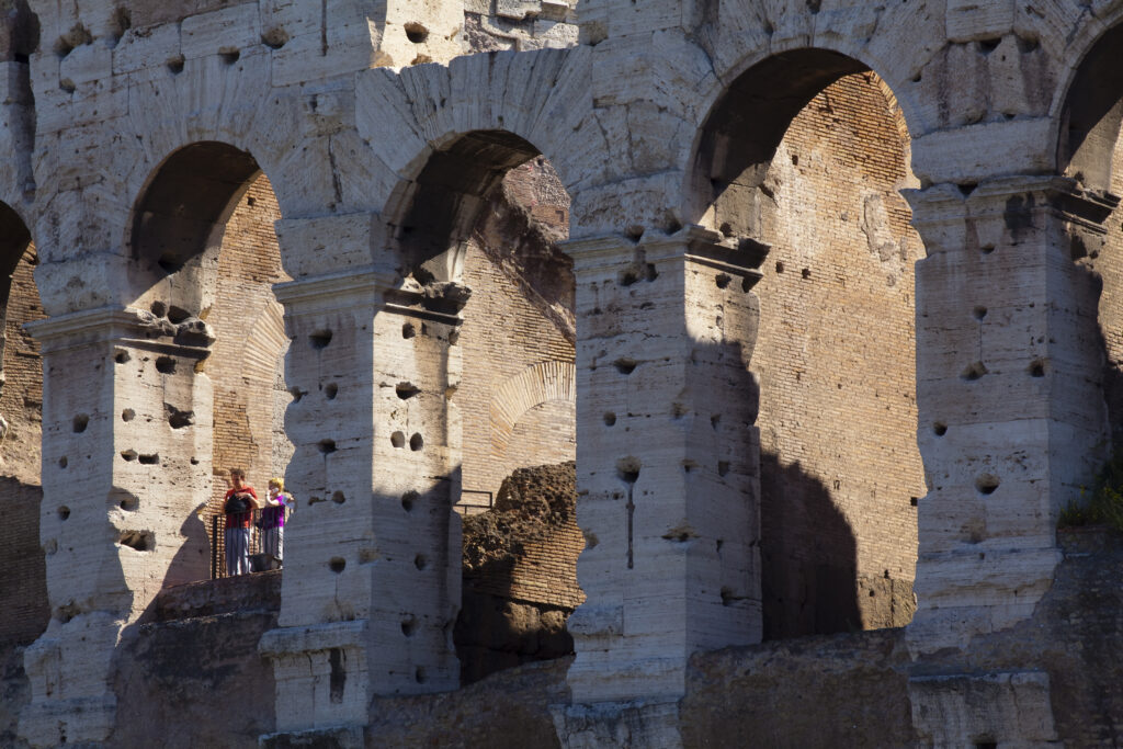 Italy, Lazio, Rome. Tourists in the Colosseum or Roman Coliseum, originally the Flavian Amphitheatre