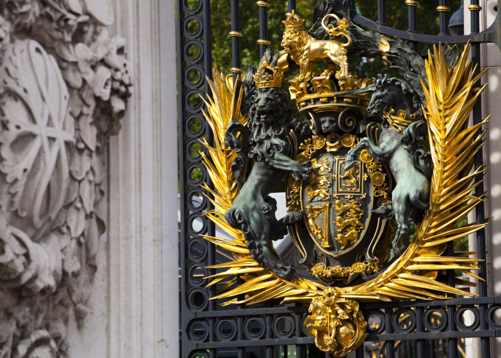 England, Greater London, City of Westminster. Royal Coat of Arms, on a gate outside Buckingham Palace.