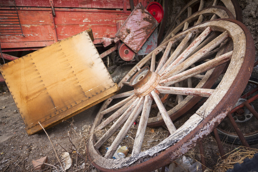 Spain, Catalonia, Pyrenees, Gósol. Wooden wheels and farming equipment in a barn in the Spanish Pyranees.