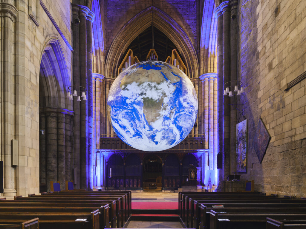 England, Northumberland, Hexham Abbey. GAIA, a 7-meter diameter artwork by Luke Jerramis, created from NASA imagery with an aim to create the 'Overview Effect'.