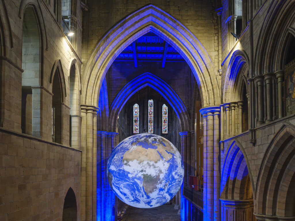 England, Northumberland, Hexham Abbey. GAIA, a 7-meter diameter artwork by Luke Jerramis, created from NASA imagery with an aim to create the 'Overview Effect'.