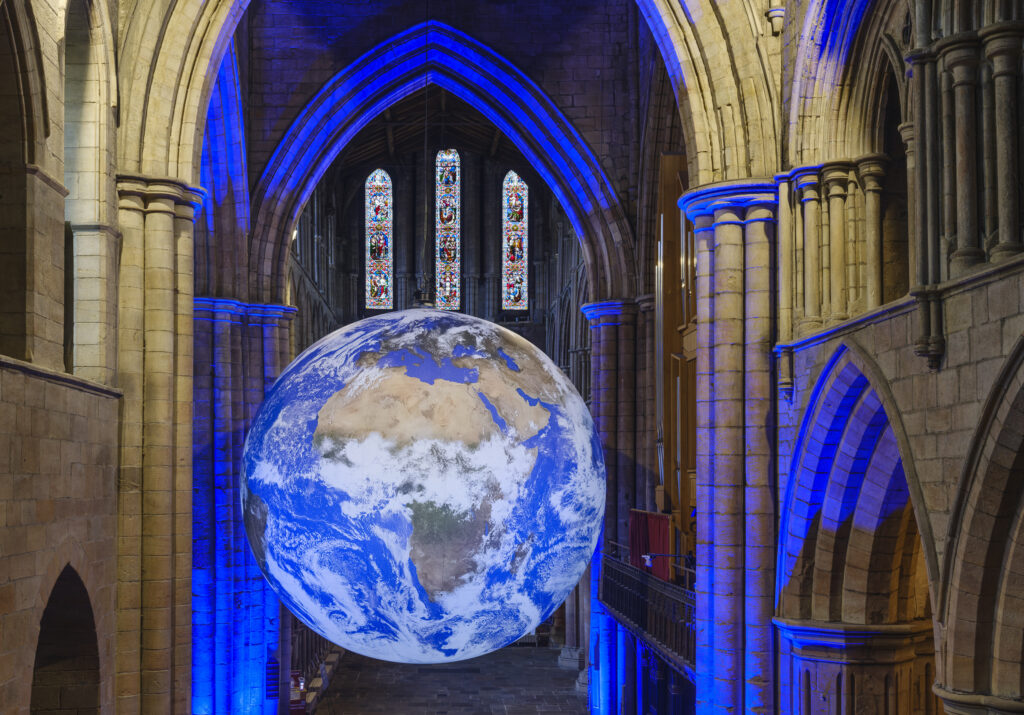 England, Northumberland, Hexham Abbey. GAIA, a 7-meter diameter artwork by Luke Jerramis, created from NASA imagery with an aim to create the 'Overview Effect'.