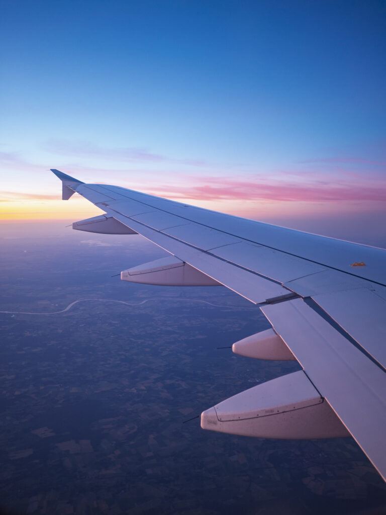 Airplane Wing Above Germany at Sunset.