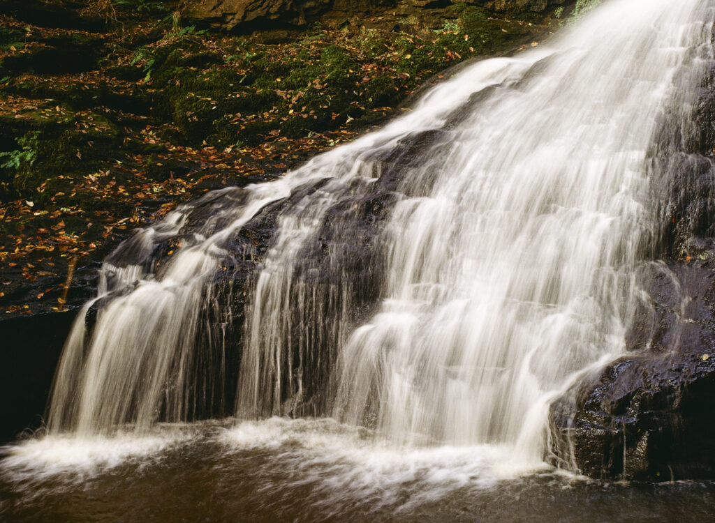 England, Northumberland, Hareshaw Linn. The flowing waterfall of Hareshaw Linn a popular spot located within Northumberland National Park.
