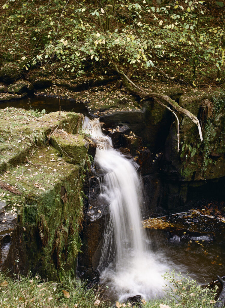 England, Northumberland, Bellingham. Small waterfall downstream of Hareshaw Linn, a popular spot located within Northumberland National Park.