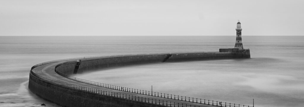 England, Tyne and Wear, Roker Pier. Roker Pier and Lighthouse located at the mouth of the River Wear in the city of Sunderland.