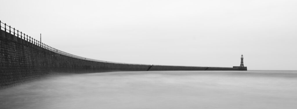 England, Tyne and Wear, Roker Pier. Roker Pier and Lighthouse located at the mouth of the River Wear in the city of Sunderland.